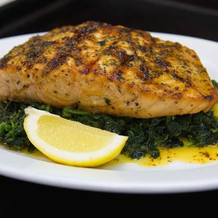 Grilled Salmon Over Spinach.